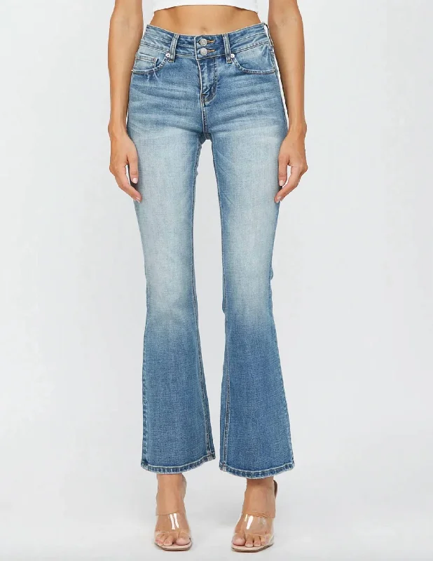 mid-range jeans -Mid Rise Double Button Bootcut Jean In Light Wash